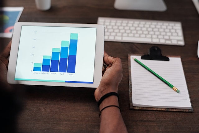 Big Data Analytics: Uncovering Insights and Driving Business Growth, a man sitting on his table and analyzing data of their company.